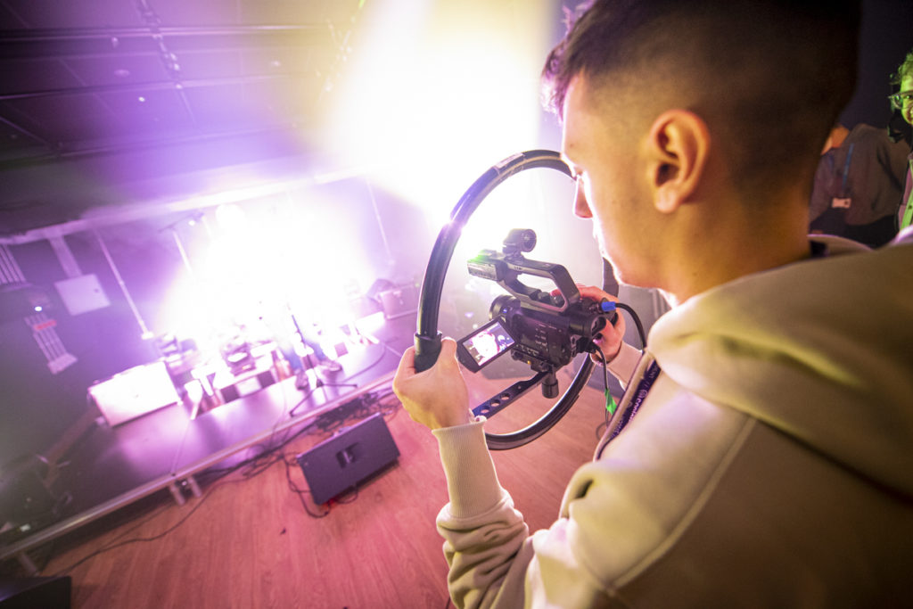 Male student capturing a live performance at Metronome, Nottingham